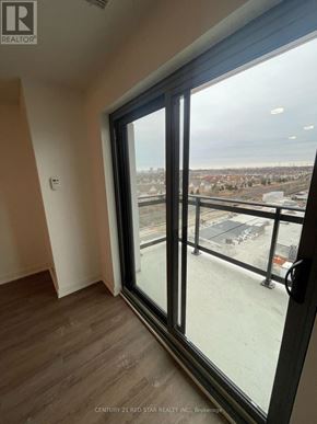 Clarington (Bowmanville) condo for rent - A view from a window in a room with Century 21 Red Star Realty Inc. written on the bottom.