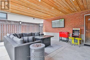 Toronto (York University Heights) apartment for rent - A living room with a grey sofa and a wooden ceiling.