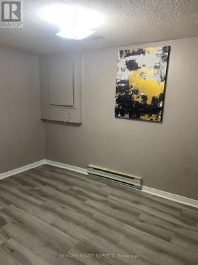 Mississauga (Hurontario) apartment for rent - A room with a grey floor and a painting on the wall.