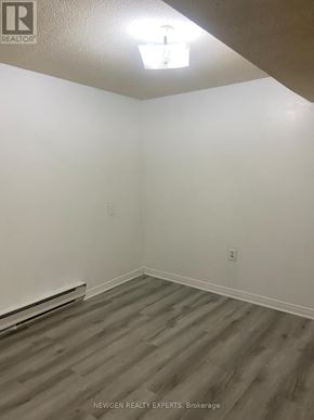 Mississauga (Hurontario) apartment for rent - A room with wooden flooring and white walls.