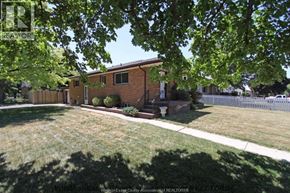 Lasalle apartment for rent - A house with a lawn and trees in front of it.