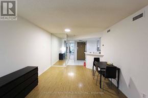 Toronto (Bay Street Corridor) condo for rent - A room with a black table and chairs in it.