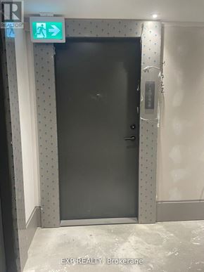 Toronto (Agincourt South-Malvern West) condo for rent - A black door with a sign above it that says "EXIT".