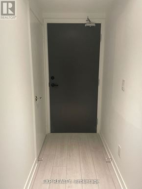 Toronto (Agincourt South-Malvern West) condo for rent - A black door in a white hallway.