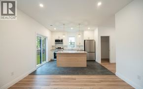 Windsor duplex for rent - A room with a white door and a grey floor.