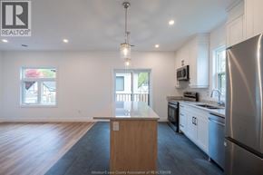 Windsor duplex for rent - A room with white walls and wooden flooring, with a yellow ball on the wall.