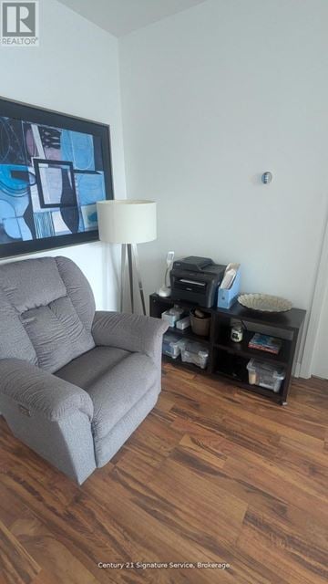 Toronto (Thorncliffe Park) house for rent - A grey couch sits in a living room with a lamp and a painting on the wall.