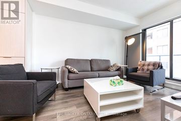 Toronto (Church-Yonge Corridor) condo for rent - A living room with a grey couch and a white coffee table.