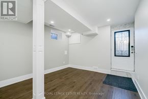 Toronto (Birchcliffe-Cliffside) apartment for rent - A room with a door and a window with a white frame.