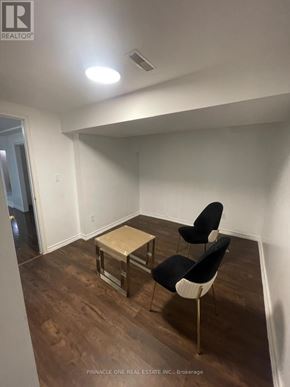 Toronto (Malvern) apartment for rent - A room with a table and two chairs.