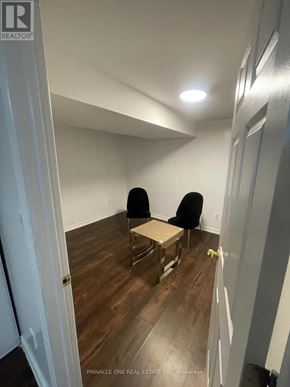 Toronto (Malvern) apartment for rent - A room with two chairs and a table in the middle.