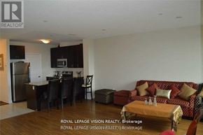 Markham (Middlefield) condo for rent - A living room with a couch, a dining table, and a kitchen area in the background.