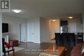 Markham (Middlefield) condo for rent - A living room with a fireplace and a television.