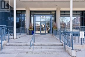 Toronto (Bayview Village) condo for rent - The entrance to a building with a glass door and a sign that says "REALTOR".