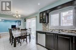 Toronto (Rouge) apartment for rent - A kitchen with a dining table and chairs.