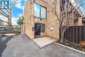 Toronto (West Hill) townhouse for rent - A brick building with a sign that says "448 LING RD" on it.