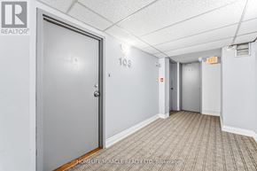 Toronto (West Hill) townhouse for rent - A hallway with a door on the left and another door on the right with an exit sign above it.