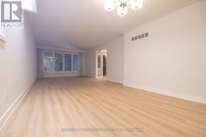 Toronto (Newtonbrook West) apartment for rent - A room with wooden flooring and a chandelier.