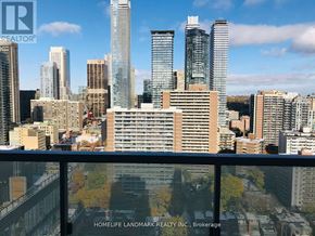 Toronto (Church-Yonge Corridor) condo for rent - A cityscape with skyscrapers and a sign for HomeLife Landmark Realty Inc. Brokerage.