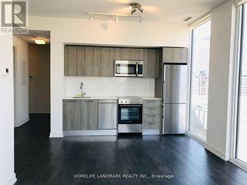 Toronto (Church-Yonge Corridor) condo for rent - A kitchen with a stainless steel refrigerator, oven, and microwave.