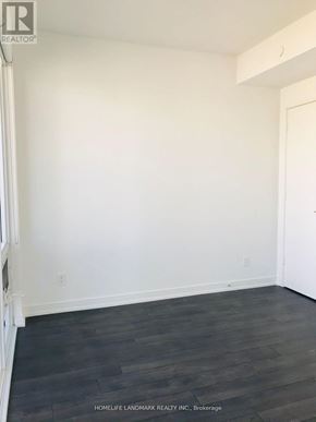 Toronto (Church-Yonge Corridor) condo for rent - A room with white walls and dark wood flooring.