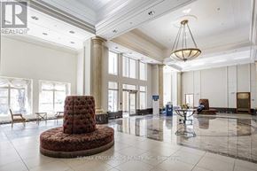 Toronto (Woburn) condo for rent - A large, elegant room with a round table and chairs in the center.