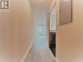 Toronto (Woburn) condo for rent - A long hallway with a door at the end.