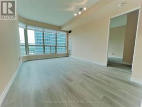 Toronto (Woburn) condo for rent - A spacious room with wooden flooring and large windows.