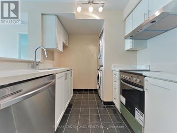 Toronto (Woburn) condo for rent - A kitchen with white cabinets and stainless steel appliances.