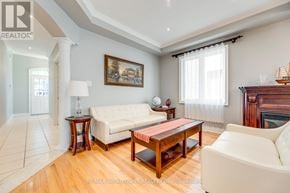 Oakville (Jc Joshua Creek) apartment for rent - A living room with a white couch and a painting on the wall.