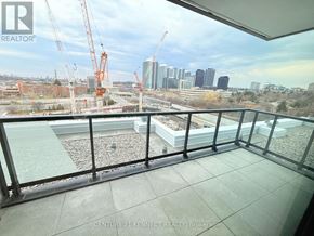 Toronto (Don Valley Village) condo for rent - A balcony with a view of a construction site and buildings in the distance.