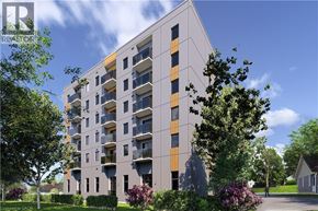 Waterloo condo for rent - A modern apartment building with balconies and trees in the foreground.
