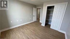 Welland apartment for rent - A room with a white door and a white cabinet.