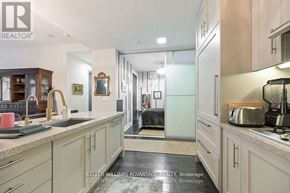 Toronto (Waterfront Communities) house for rent - A kitchen with a sink, cabinets, and a counter.