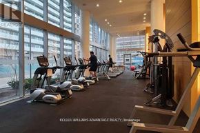 Toronto (Waterfront Communities) house for rent - A gym with treadmills and weights is shown.