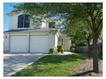 Round Rock house for rent - A white house with a tree in front.