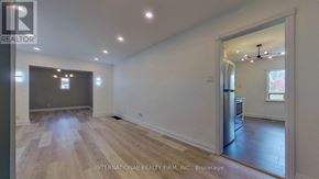 Toronto (Willowdale West) apartment for rent - A spacious room with wooden flooring and a large window.