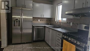 Brampton (Central Park) townhouse for rent - A kitchen with a refrigerator, stove, and dishwasher.