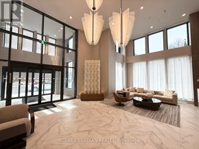Hamilton (Corktown) condo for rent - A spacious living room with a large marble floor and a high ceiling.