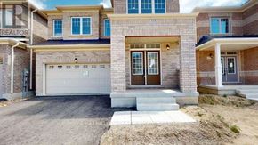 Shelburne apartment for rent - A house with a garage and a driveway in front.