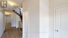 Shelburne apartment for rent - A hallway with a staircase and a door on the right.