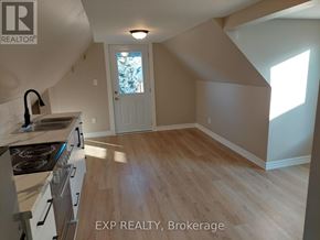 Hamilton (Gibson) apartment for rent - A kitchen with a stove top oven and a window.
