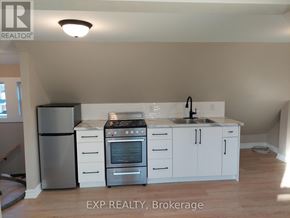 Hamilton (Gibson) apartment for rent - A kitchen with white cabinets and stainless steel appliances.