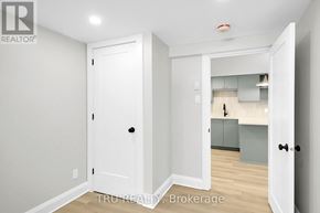 Ottawa apartment for rent - A white door is open to a kitchen area.