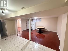 Toronto (Woburn) apartment for rent - A room with a table in the middle of the room.