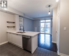 Burlington condo for rent - A modern kitchen with a sink and a dishwasher.