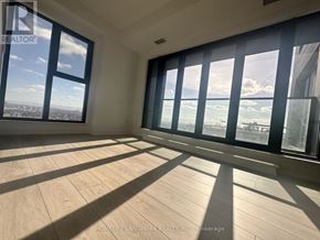 Toronto (Mount Pleasant West) condo for rent - A sunny room with a view of the city and the ocean.