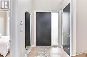 Blue Mountains apartment for rent - A bedroom with a bed, a mirror, and a door.
