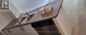 Hamilton (Waterdown) condo for rent - A kitchen with a sink and a dishwasher.