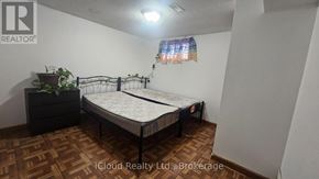 Toronto (Wexford-Maryvale) apartment for rent - A bedroom with a bed, dresser, and plant.